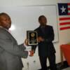 President Kalapele present award to Robert Dolo